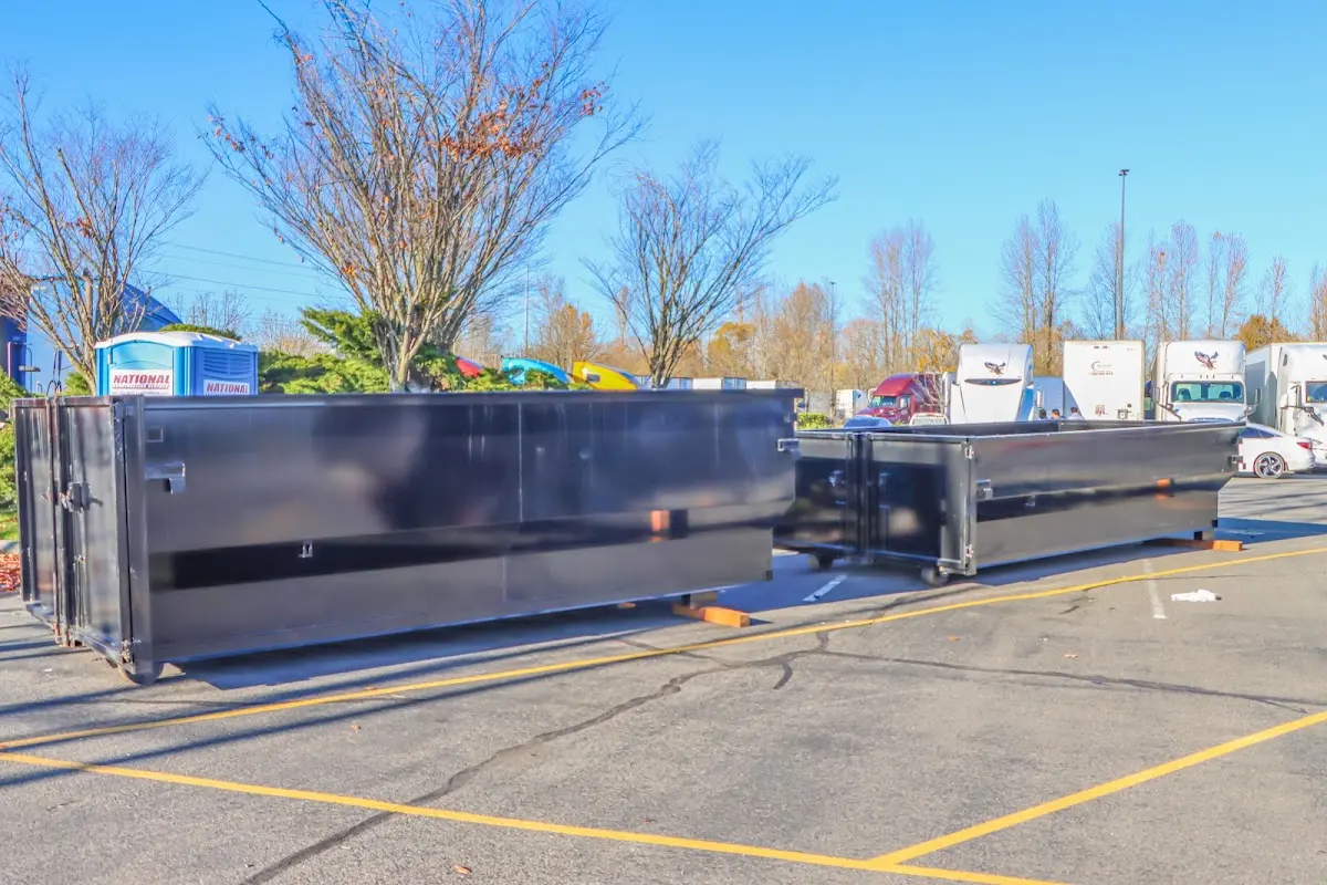 Professional dumpster rental service with roll-off container on residential driveway in Northfield